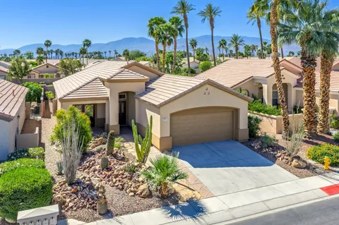 front view of house with potted plants