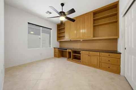 a kitchen with wooden cabinets and a stove top oven