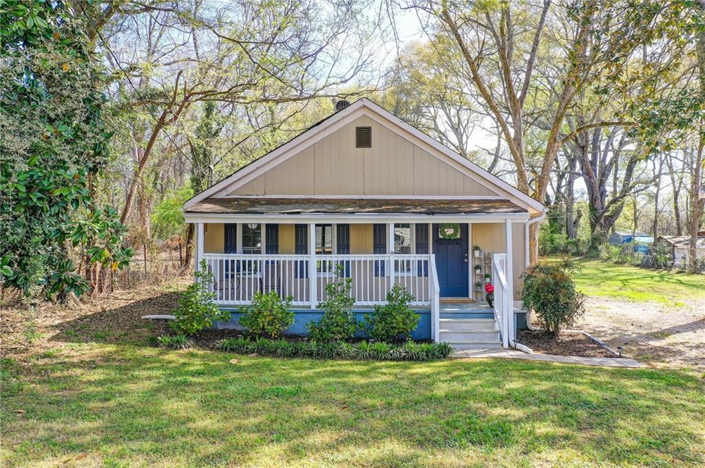 411 Ash Street Monroe, GA 30655 - Photo 24 of 36 a front view of a house with garden