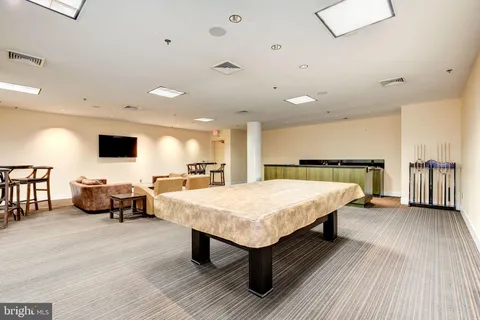 a spacious bedroom with a bed and a couch