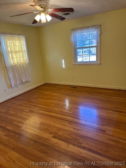 180 Castle Road Lumberton, NC 28358 - Photo 16 of 18 a view of an empty room with wooden floor and a window