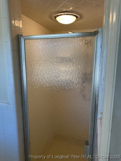 180 Castle Road Lumberton, NC 28358 - Photo 18 of 18 a bathroom with a glass shower door