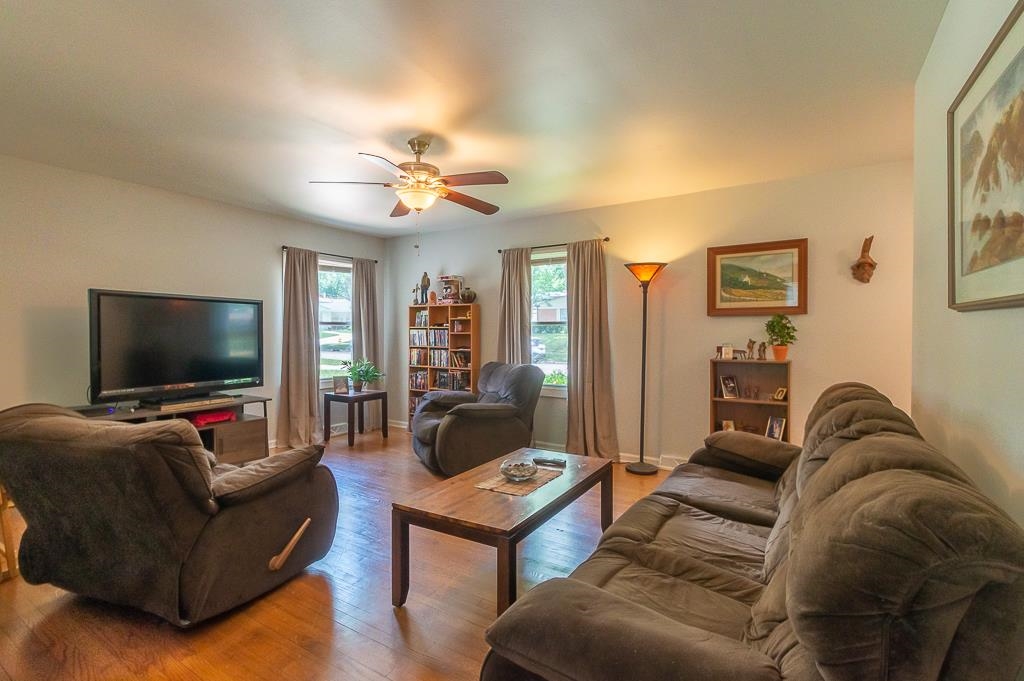 5117 Highcrest Road Rockford, IL 61107 - Photo 3 of 20 a living room with furniture and a flat screen tv