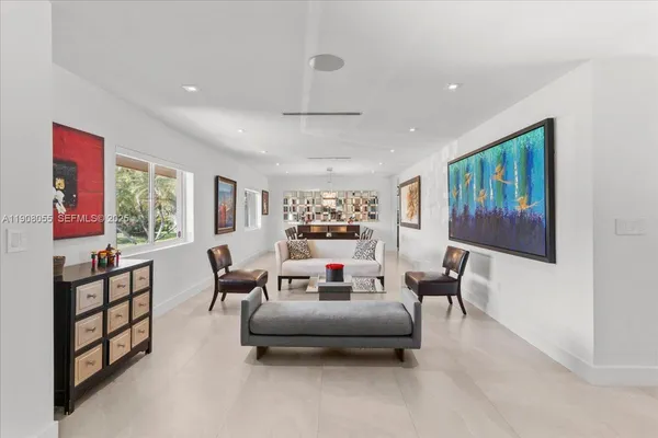 a living room with furniture and a large window