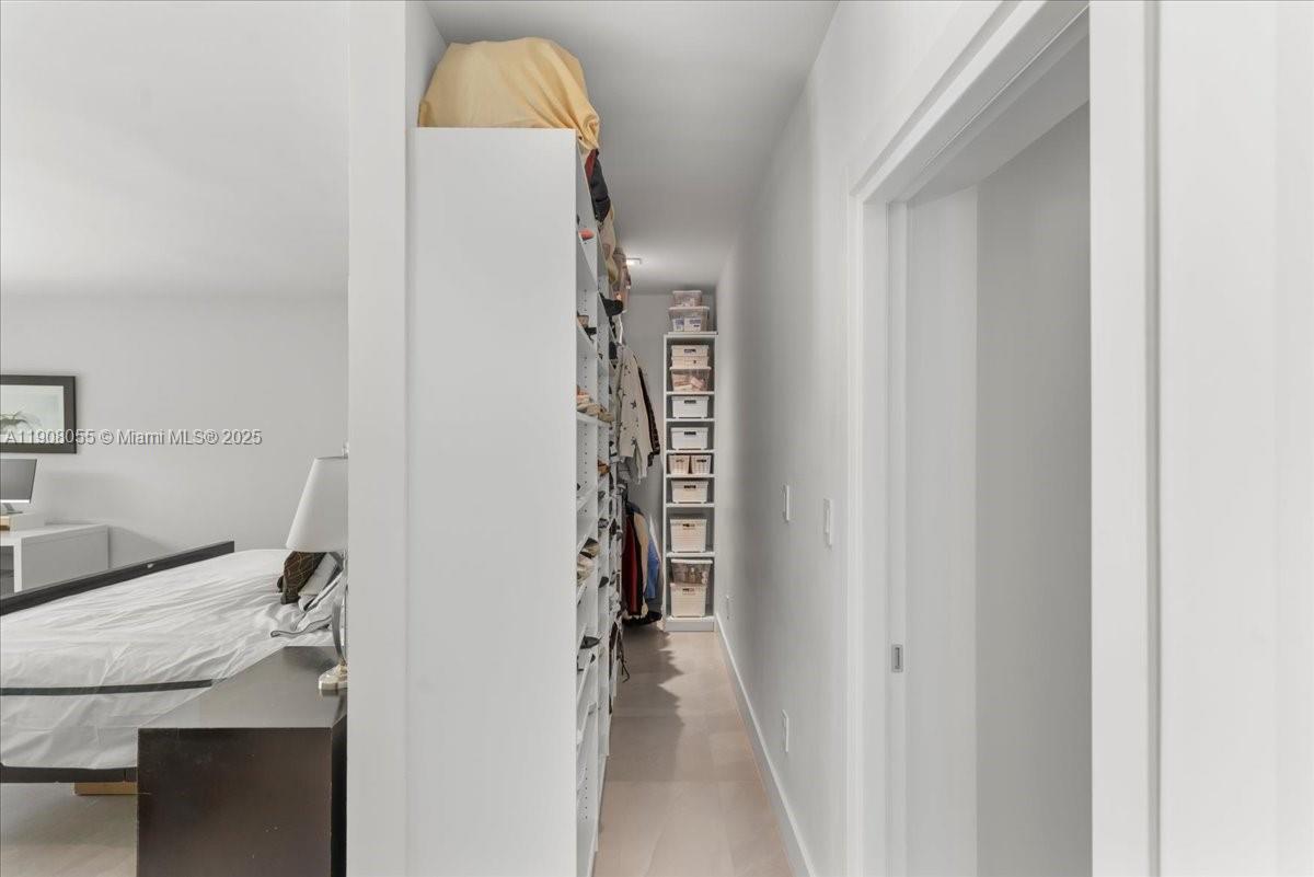 10105 Southwest 71st Avenue Pinecrest, FL 33156 - Photo 28 of 55 a view of a bathroom from a hallway