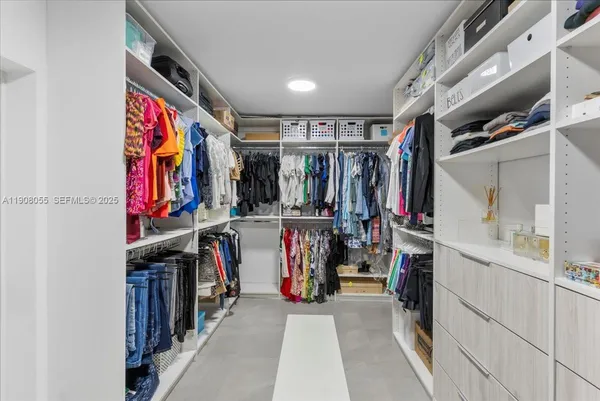 a bathroom with a shower and sink