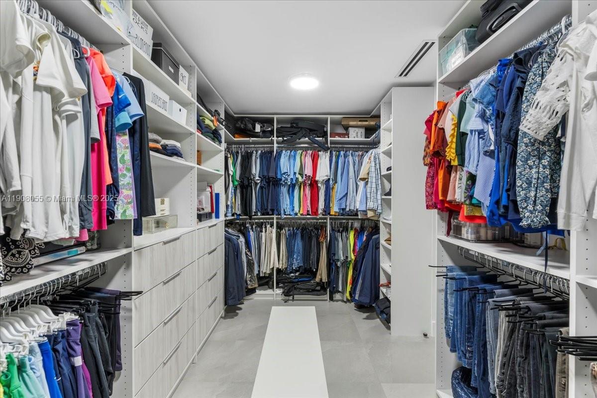 10105 Southwest 71st Avenue Pinecrest, FL 33156 - Photo 30 of 55 a view of walk in closet with clothes
