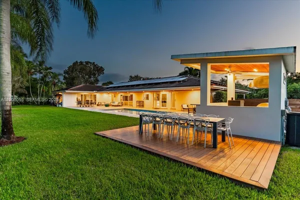 a view of a patio with swimming pool table and chairs