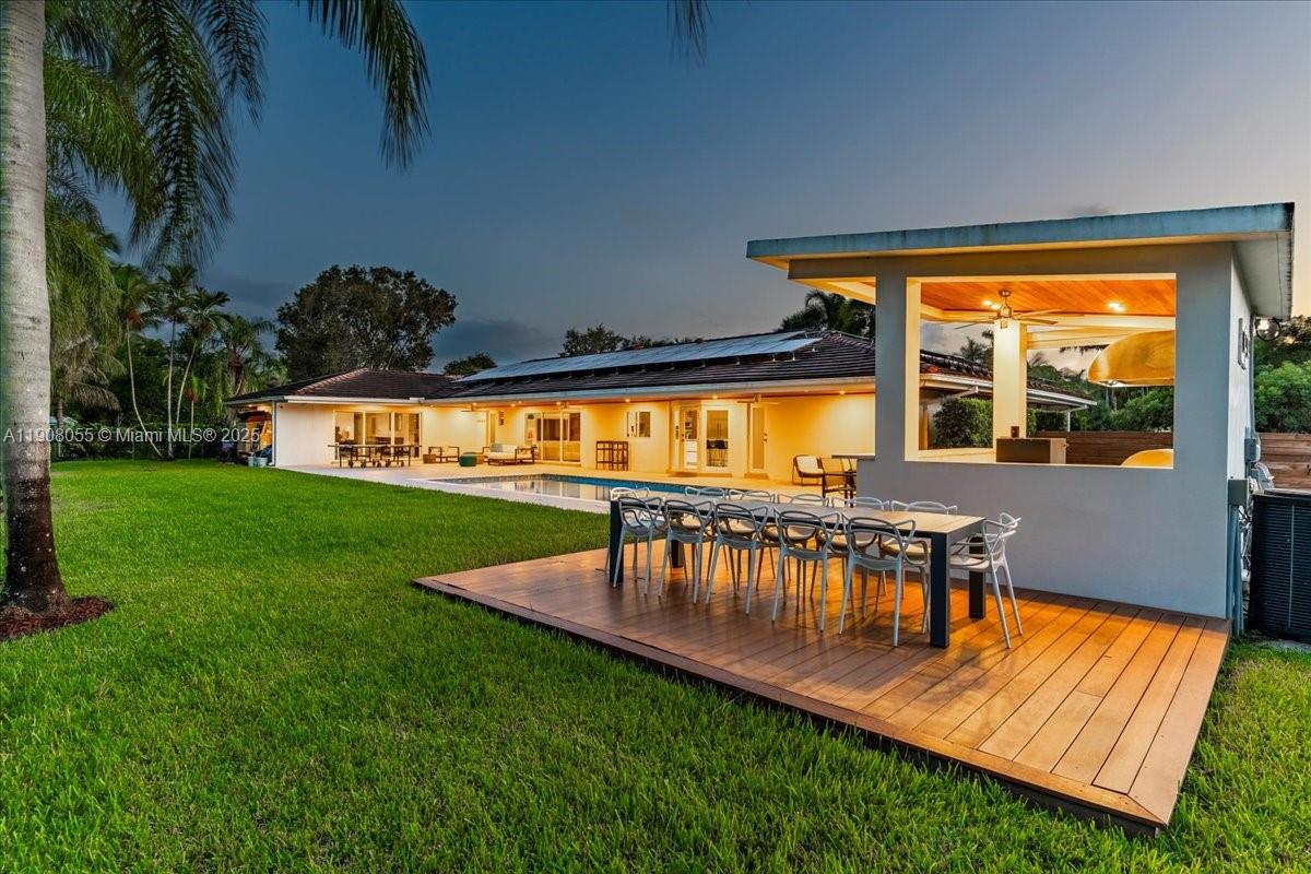 10105 Southwest 71st Avenue Pinecrest, FL 33156 - Photo 3 of 55 a view of swimming pool with a table and chairs in patio