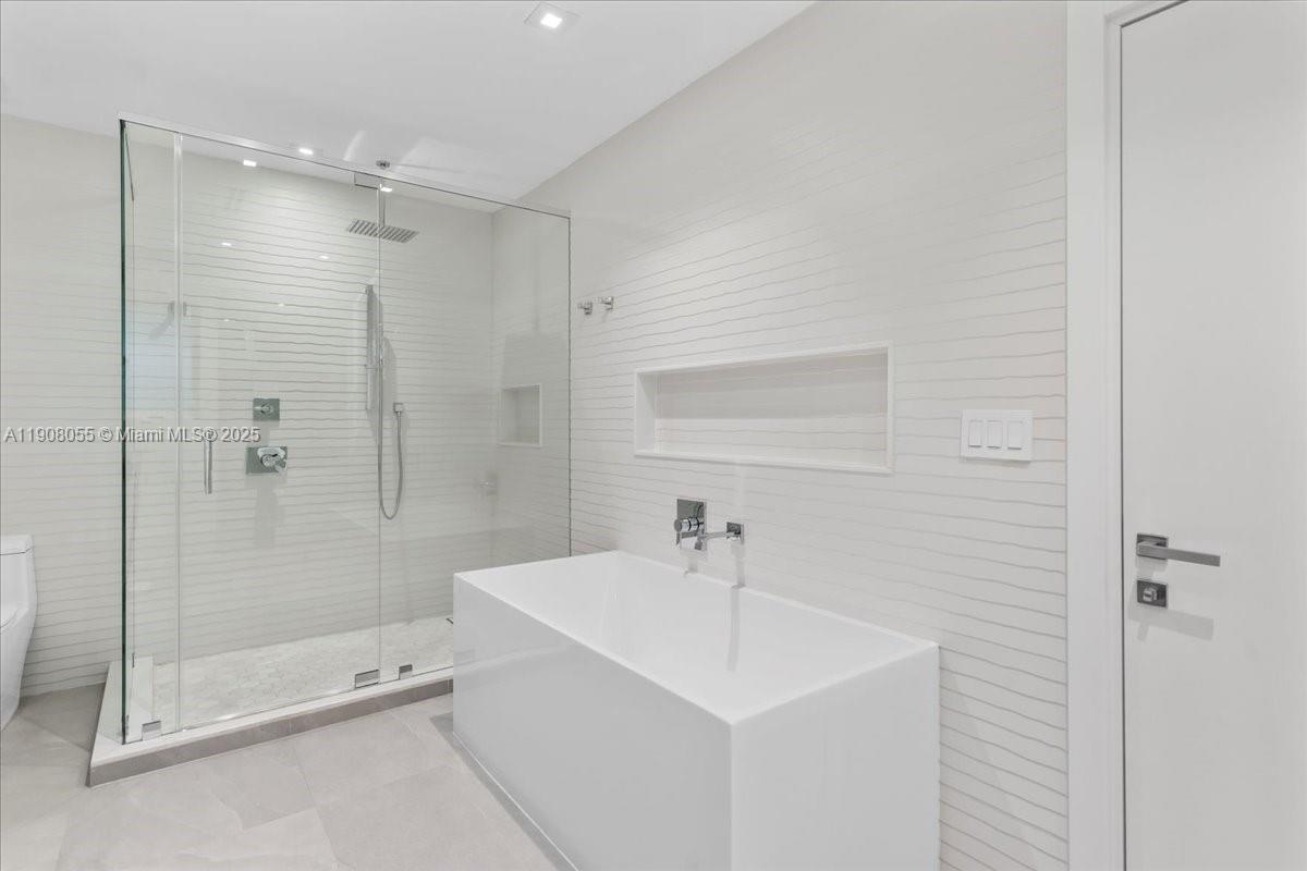 10105 Southwest 71st Avenue Pinecrest, FL 33156 - Photo 33 of 55 a bathroom with a shower and sink