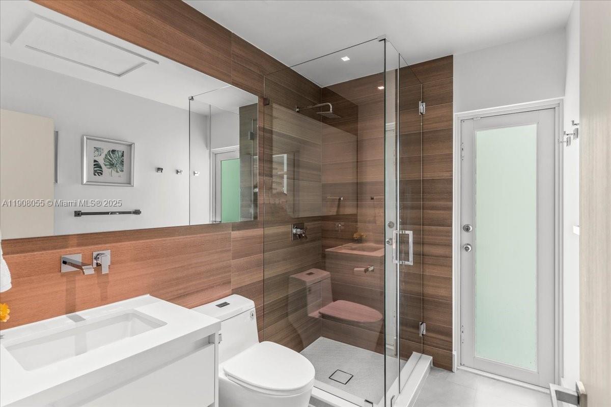 10105 Southwest 71st Avenue Pinecrest, FL 33156 - Photo 35 of 55 a bathroom with a toilet a sink and shower