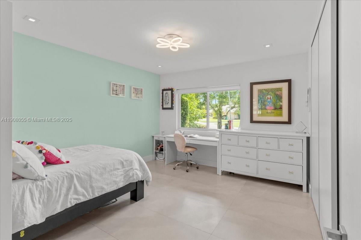 10105 Southwest 71st Avenue Pinecrest, FL 33156 - Photo 36 of 55 a bedroom with a bed and a window