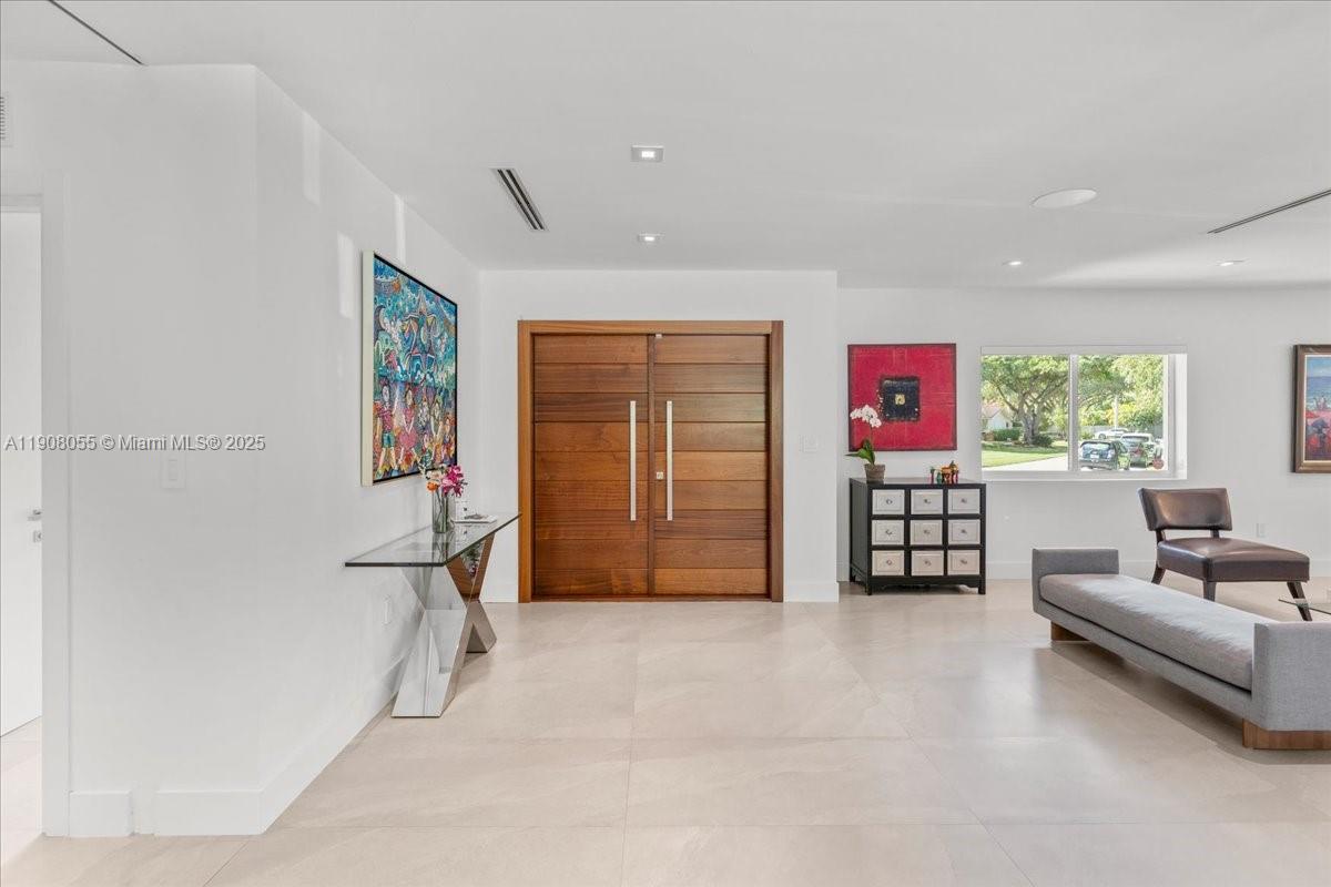 10105 Southwest 71st Avenue Pinecrest, FL 33156 - Photo 9 of 55 a living room with furniture and a window