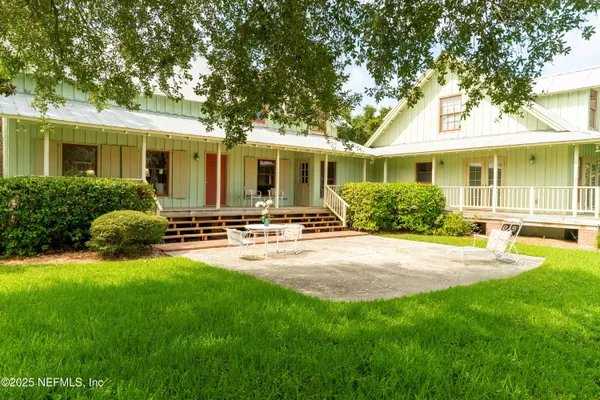 a front view of house with yard and green space