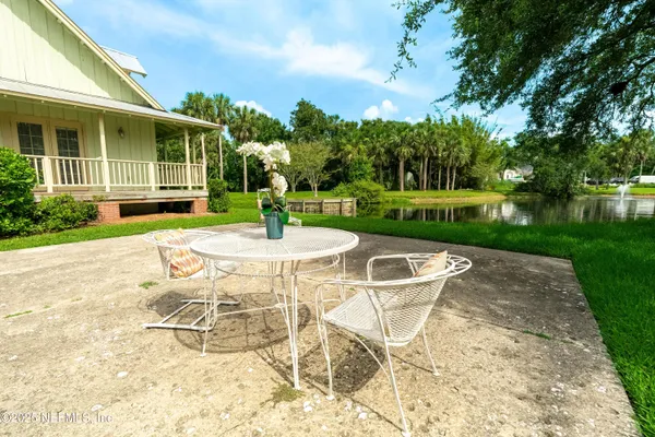a view of a table and chairs in the garden
