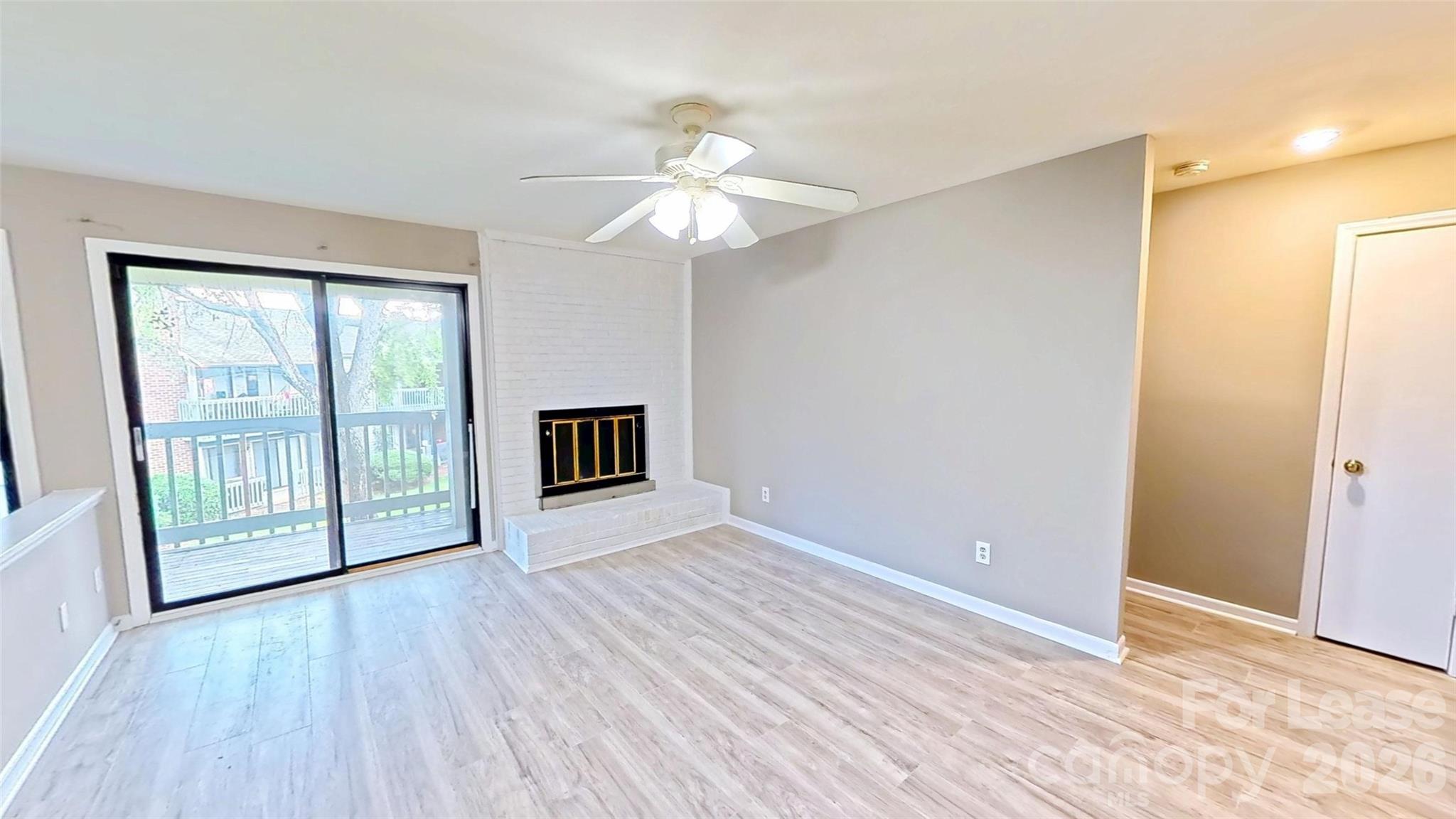 11139 Harrowfield Road Charlotte, NC 28226 - Photo 1 of 6 a view of an empty room with wooden floor and a window