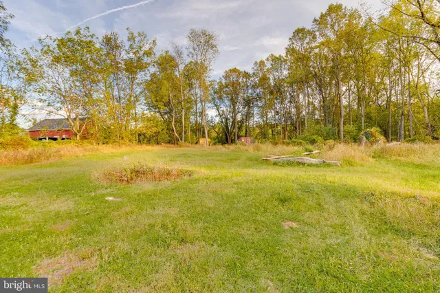 a swimming pool with wooden fence