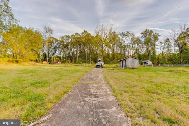 a swimming pool with trees in the background