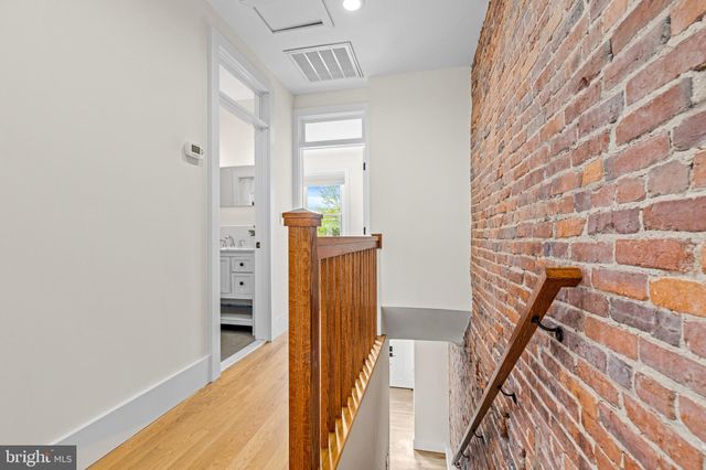 a view of a livingroom with furniture and stairs