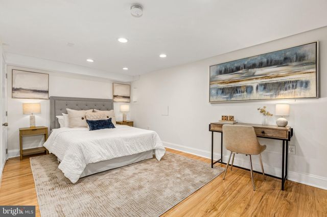 a bedroom with a bed and dresser