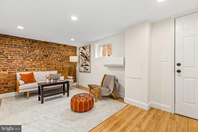 a bathroom with a shower sink and mirror