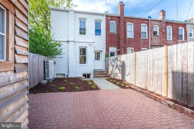 a view of a house with iron fence