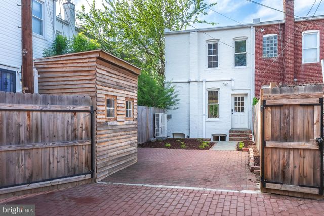 a brick house with a sink and front view of a house