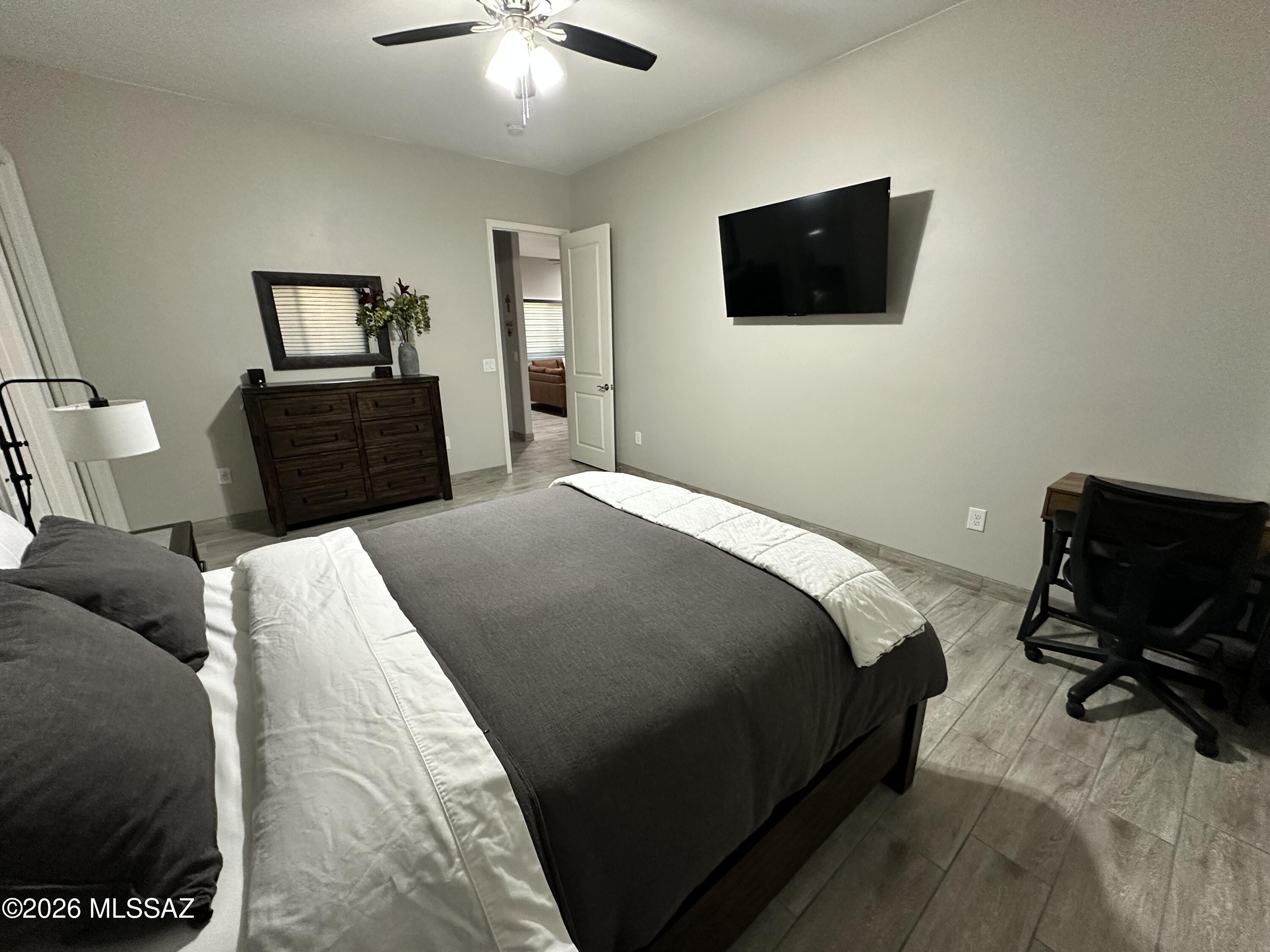 117 Ver Patria Rio Rico, AZ 85648 - Photo 17 of 28 a bedroom with a bed and a flat screen tv