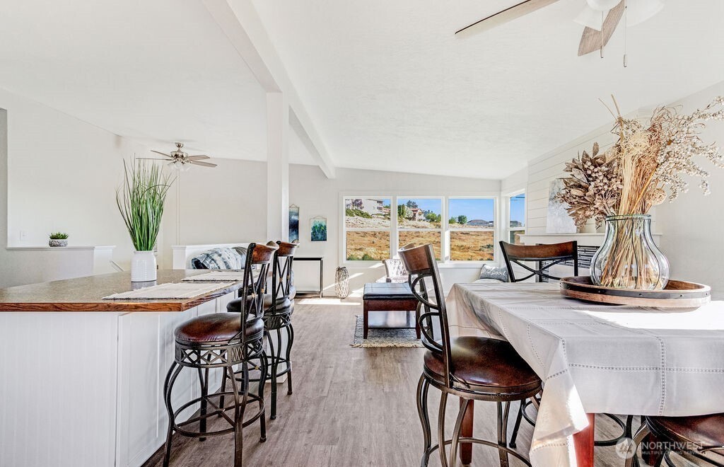 128 West Nelson Road Moses Lake, WA 98837 - Photo 11 of 37 a view of a dining room with furniture and wooden floor
