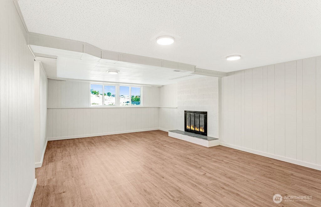 128 West Nelson Road Moses Lake, WA 98837 - Photo 18 of 37 a view of a room with wooden floor and fireplace