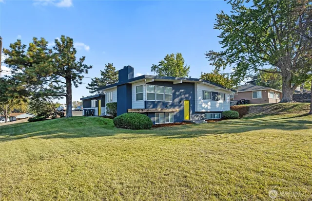 a front view of a house with a yard
