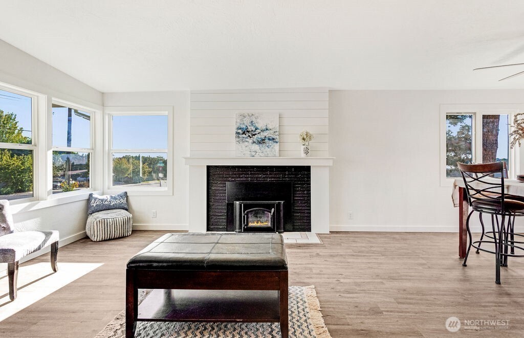 128 West Nelson Road Moses Lake, WA 98837 - Photo 5 of 37 a living room with furniture and a fireplace