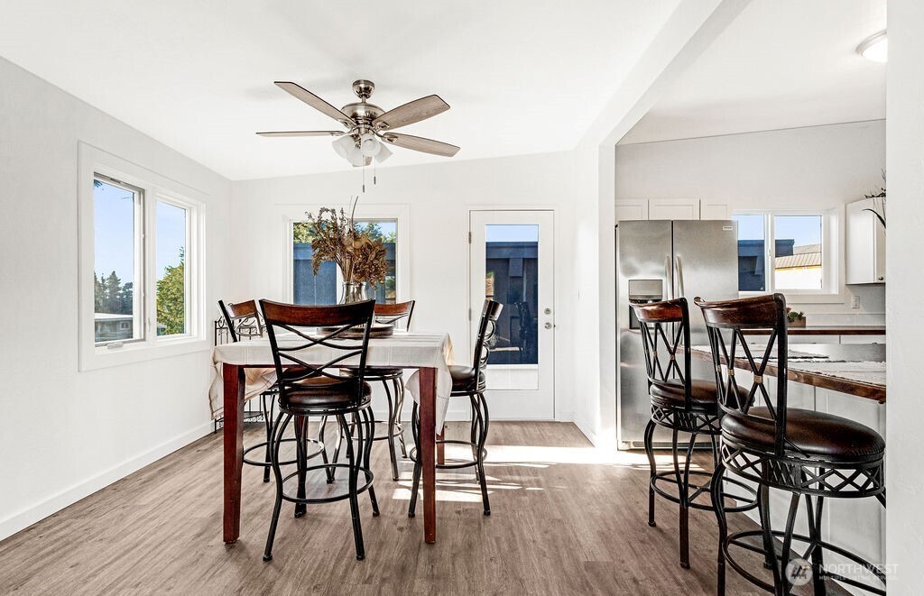 128 West Nelson Road Moses Lake, WA 98837 - Photo 6 of 37 a view of a dining room with furniture and wooden floor