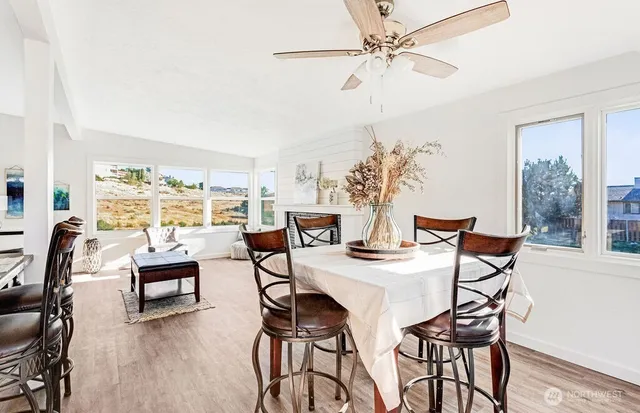 a view of a dining room with furniture window and outside view