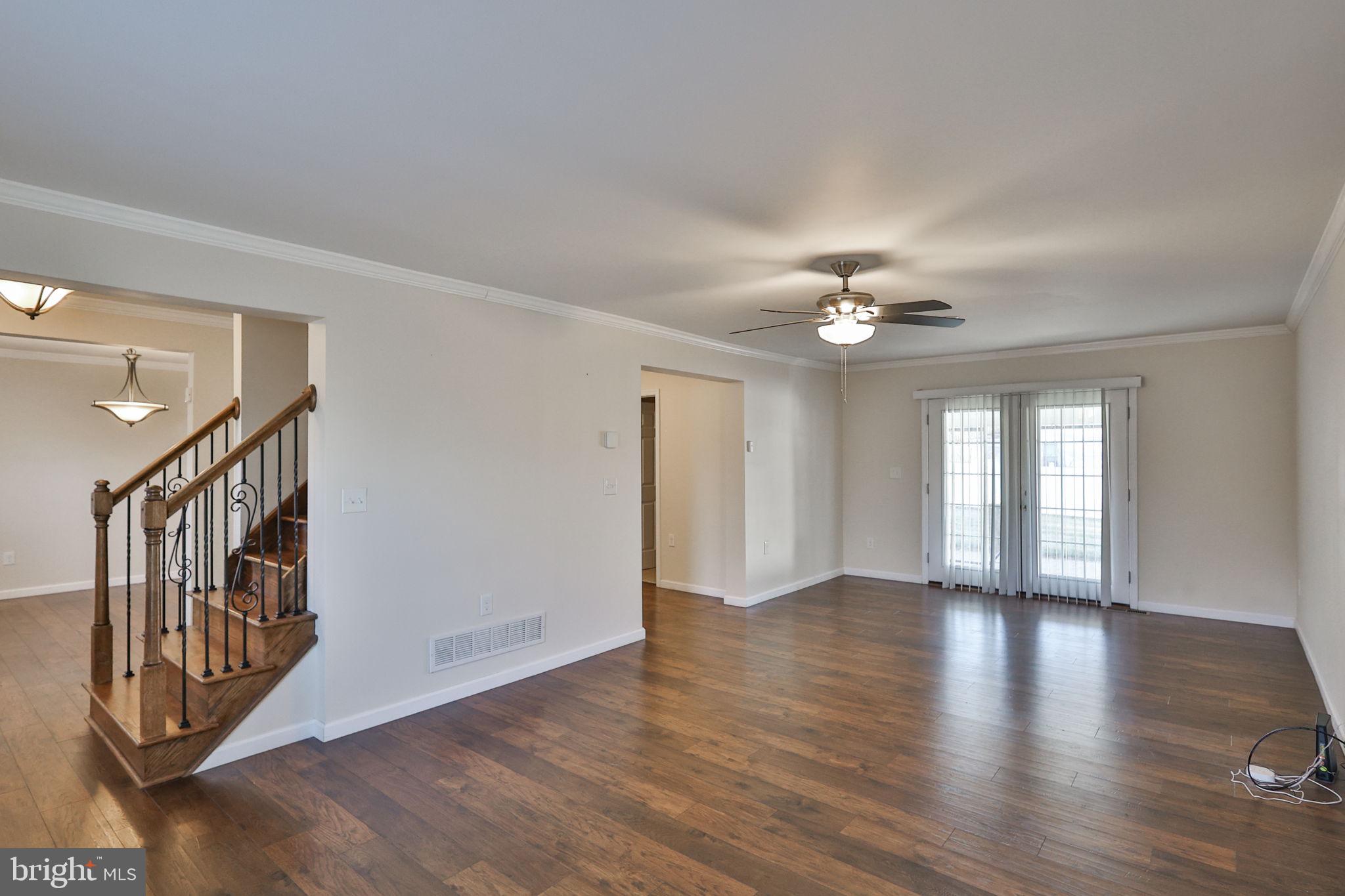 2811 Kingsview Avenue Easton, PA 18045 - Photo 11 of 86 a view of an empty room with wooden floor and a ceiling fan