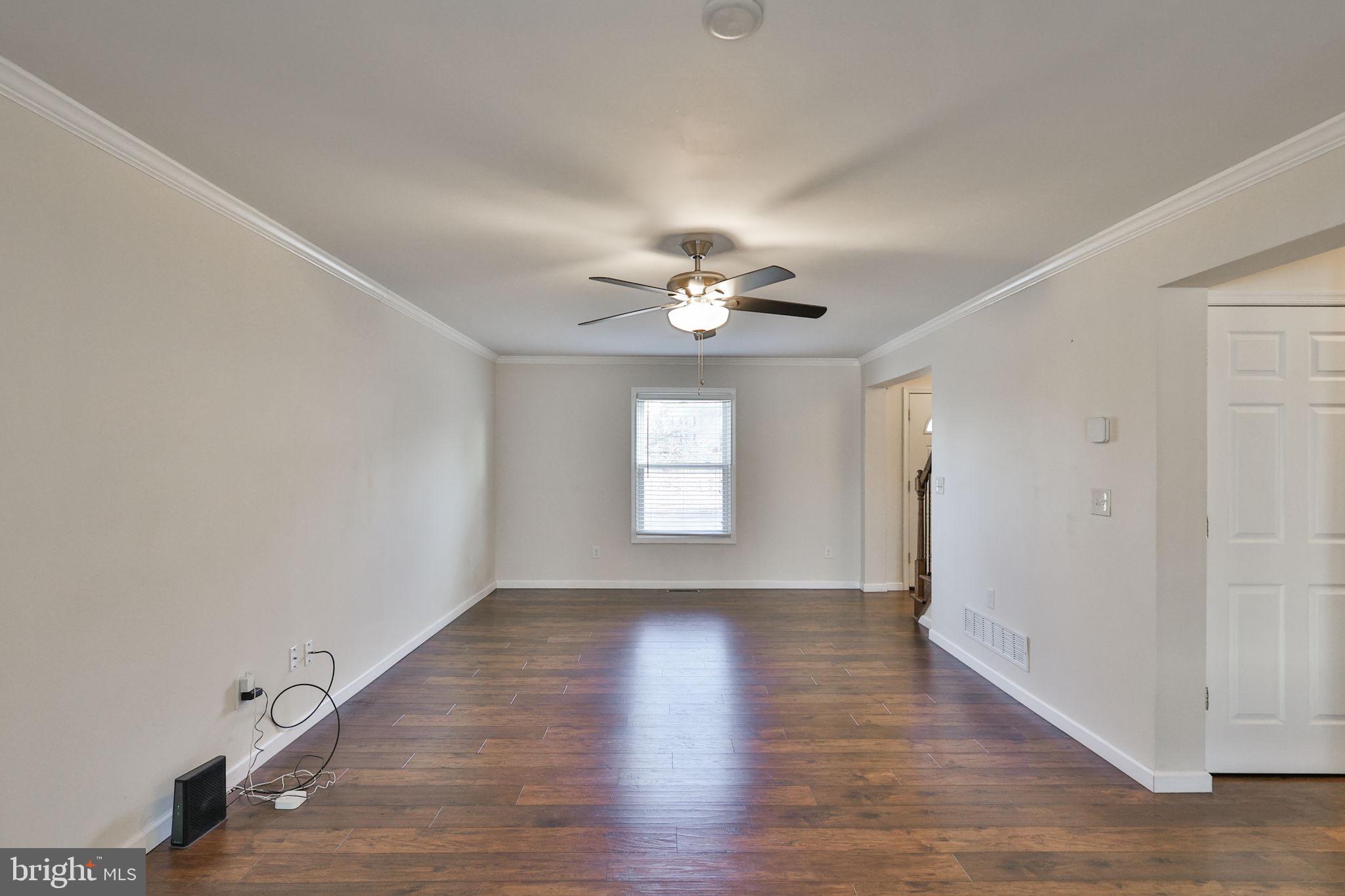 2811 Kingsview Avenue Easton, PA 18045 - Photo 14 of 86 a view of an empty room with wooden floor and a window