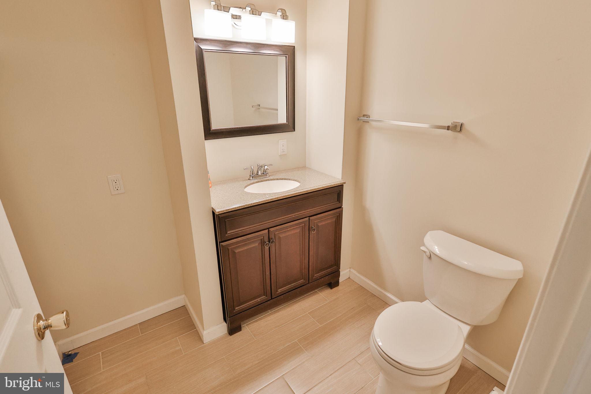 2811 Kingsview Avenue Easton, PA 18045 - Photo 17 of 86 a bathroom with a toilet sink vanity and mirror