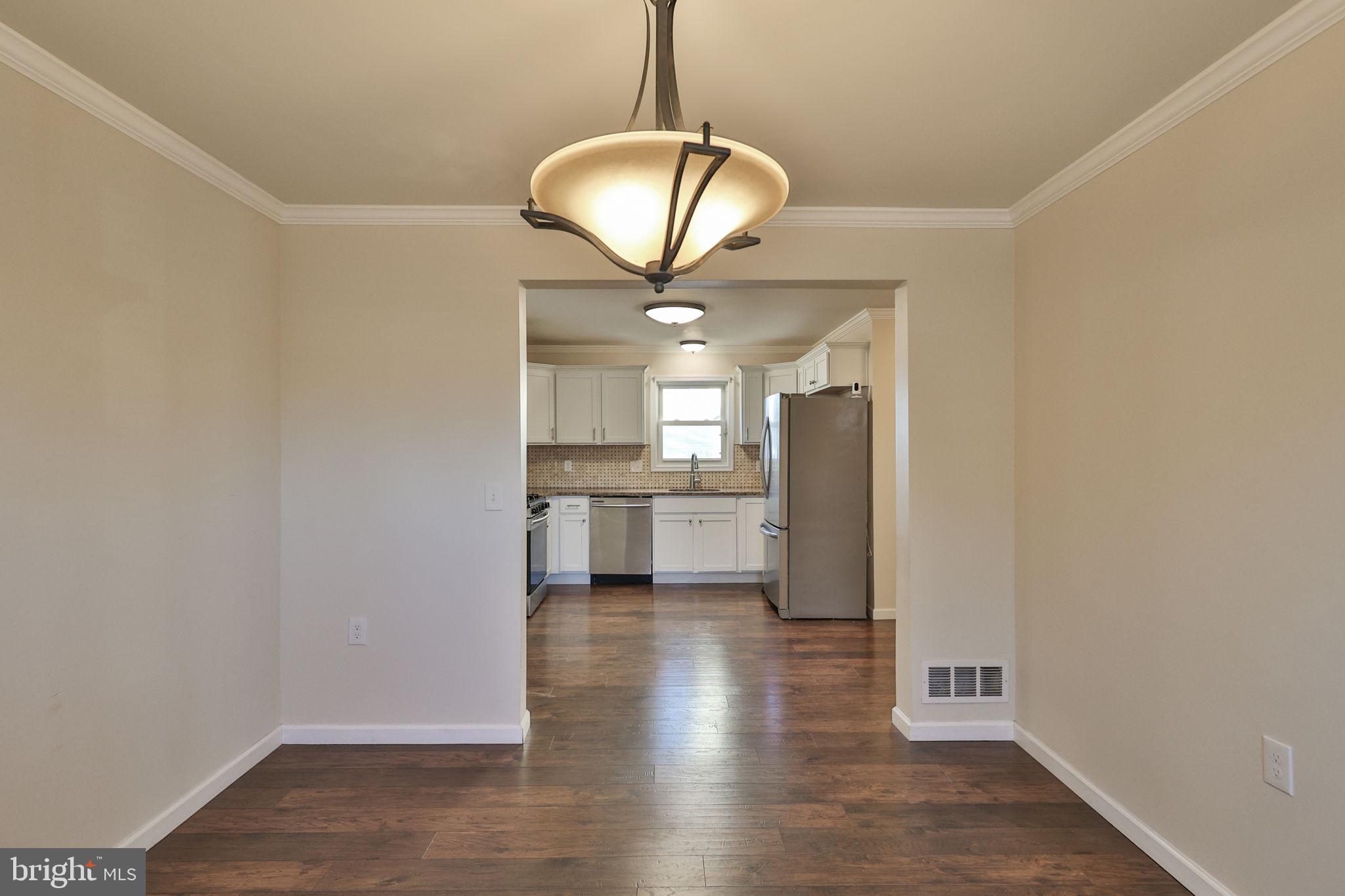 2811 Kingsview Avenue Easton, PA 18045 - Photo 20 of 86 a view of a kitchen with a sink and dishwasher a refrigerator with wooden floor