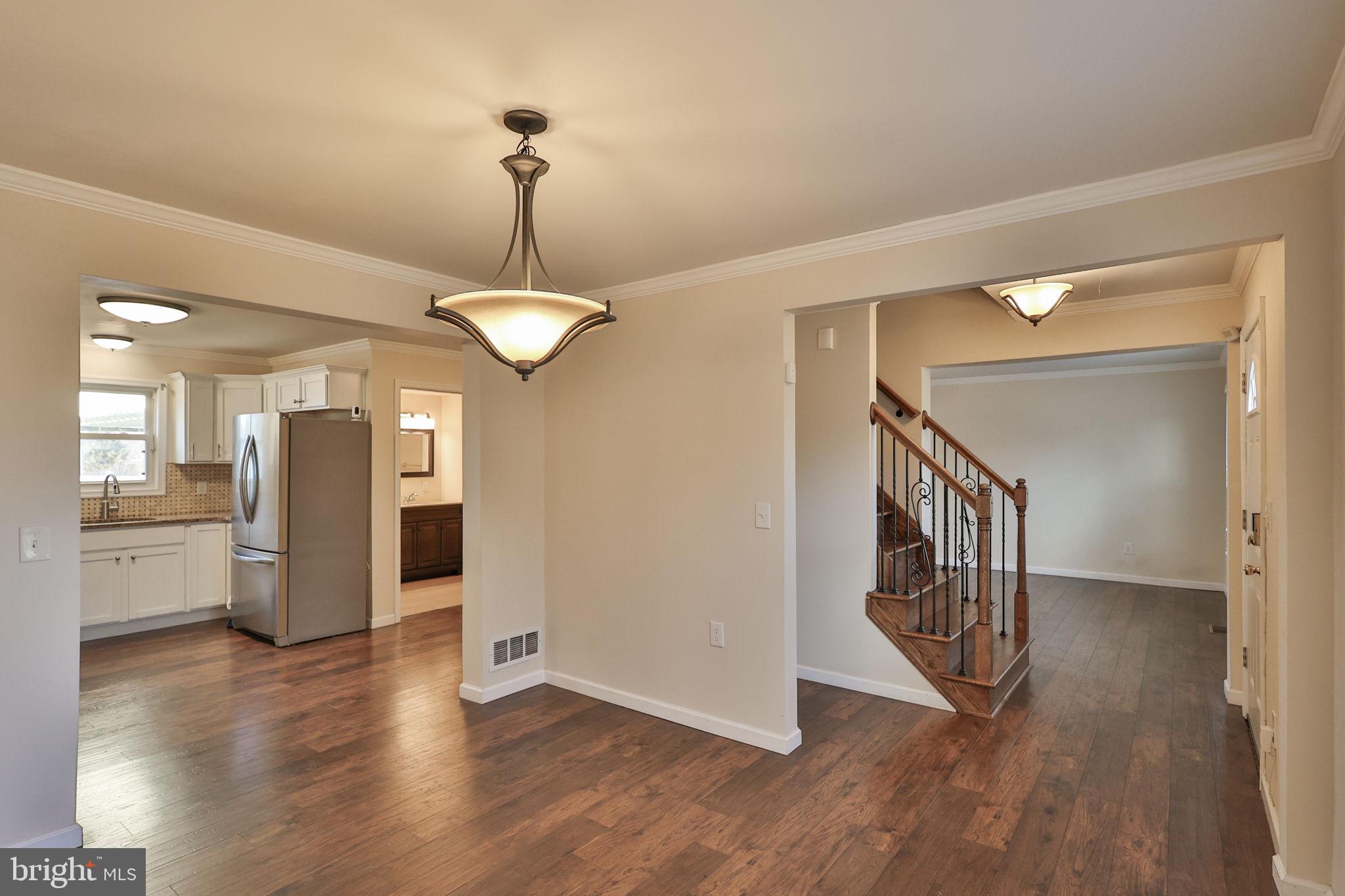 2811 Kingsview Avenue Easton, PA 18045 - Photo 21 of 86 a view of a hallway with wooden floor and a kitchen