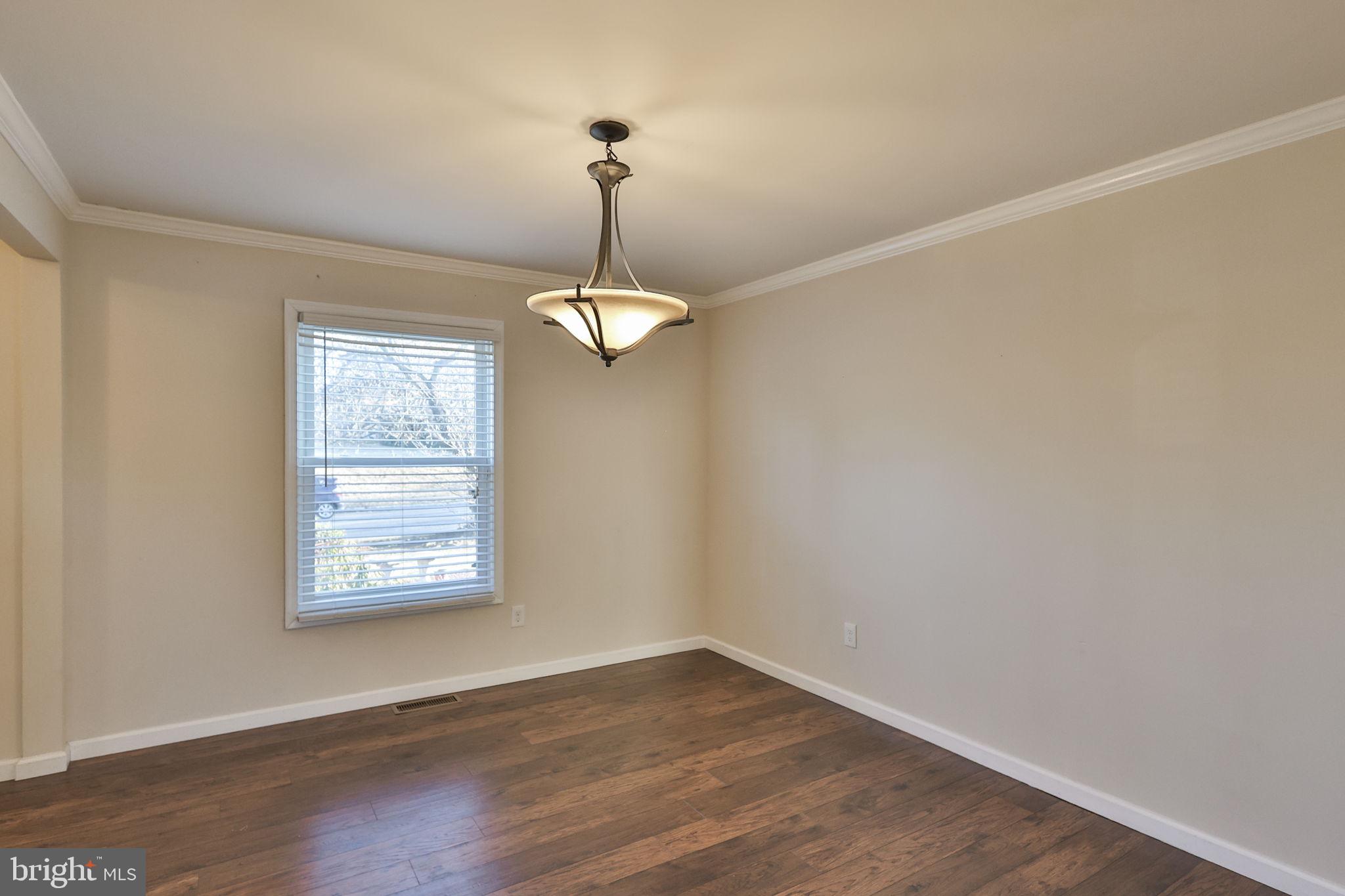 2811 Kingsview Avenue Easton, PA 18045 - Photo 24 of 86 an empty room with wooden floor chandelier and windows