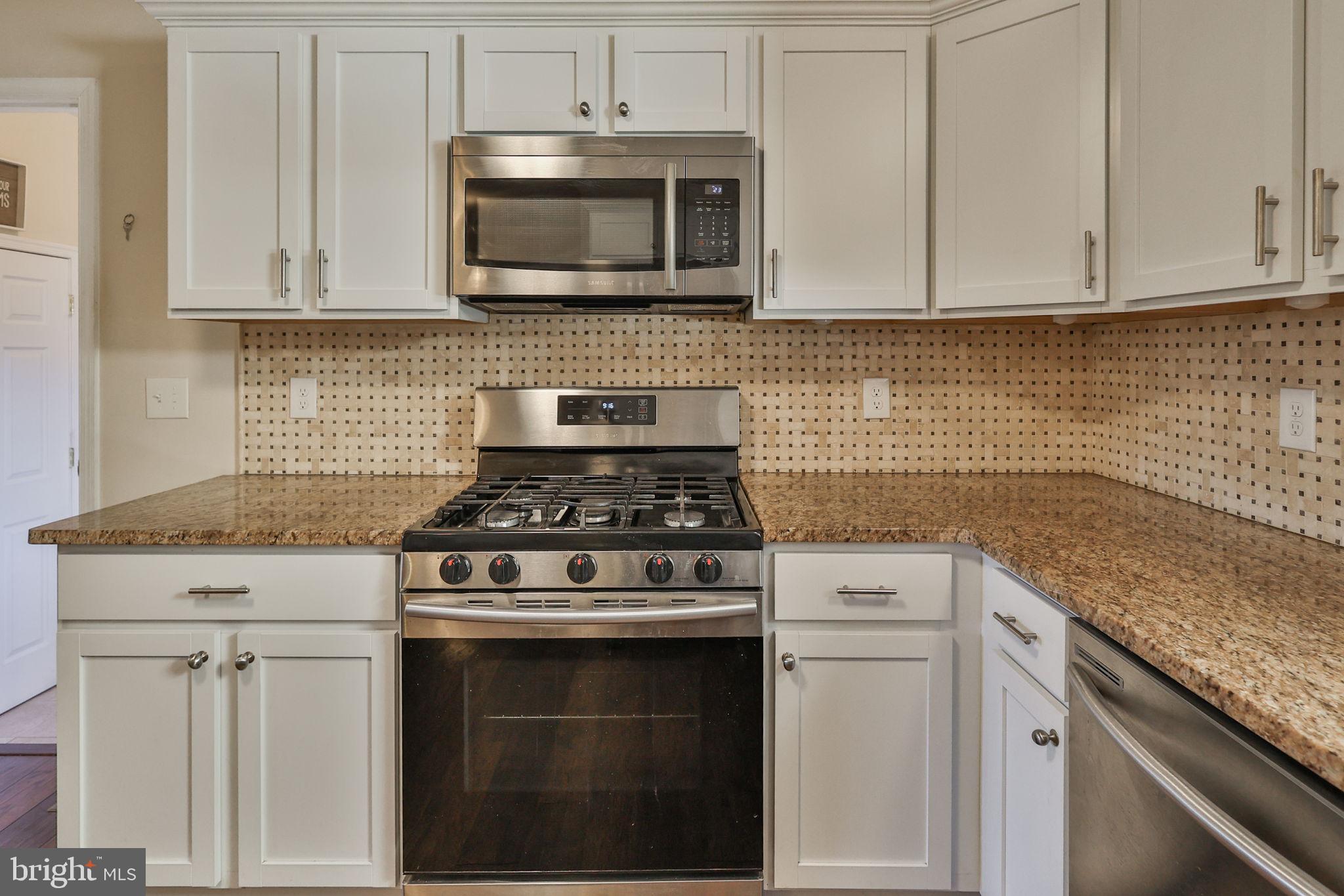 2811 Kingsview Avenue Easton, PA 18045 - Photo 28 of 86 a kitchen with granite countertop white cabinets and stainless steel appliances