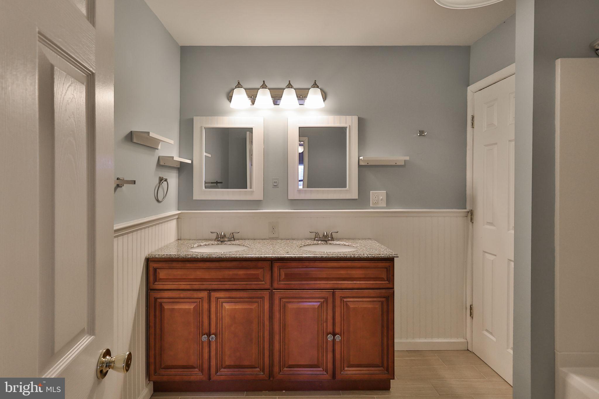 2811 Kingsview Avenue Easton, PA 18045 - Photo 54 of 86 a bathroom with a granite countertop sink and a mirror