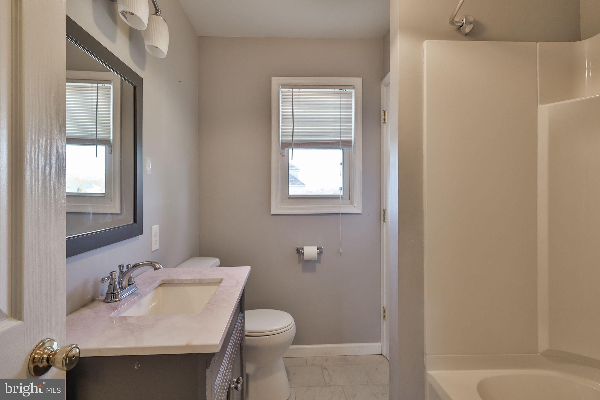 2811 Kingsview Avenue Easton, PA 18045 - Photo 61 of 86 a bathroom with a granite countertop sink toilet and shower