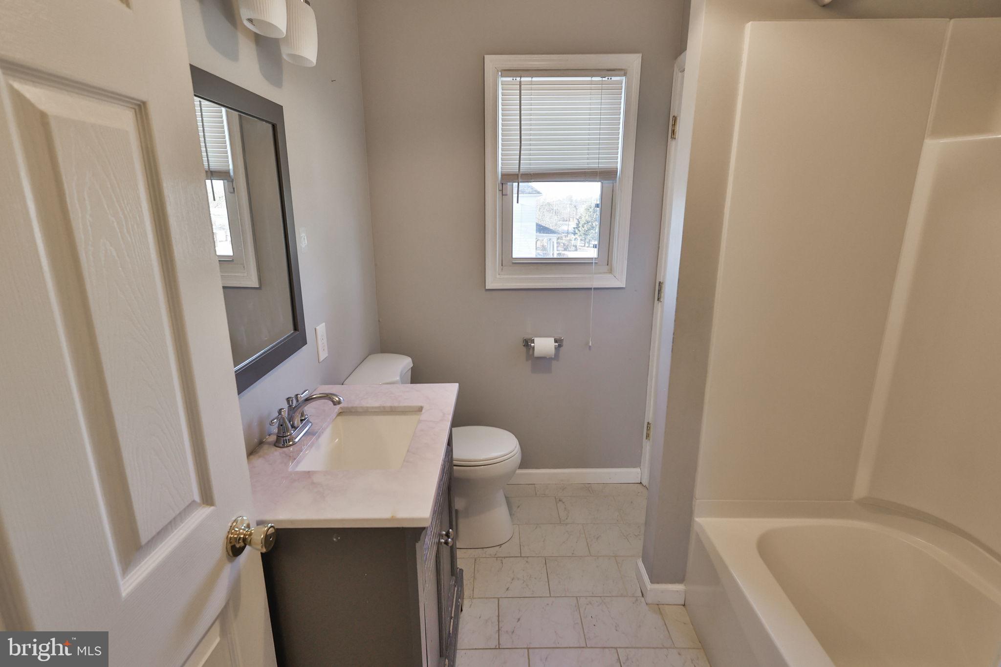 2811 Kingsview Avenue Easton, PA 18045 - Photo 62 of 86 a bathroom with a sink a toilet and shower
