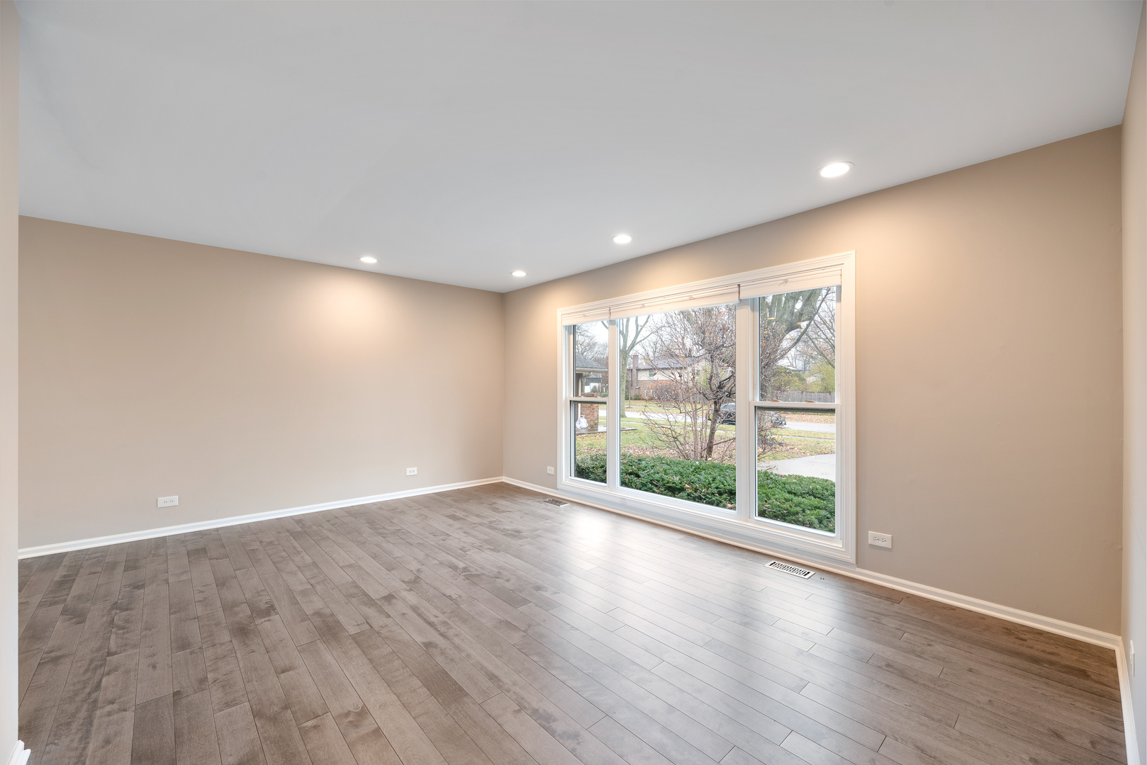 3231 Maple Leaf Drive Glenview, IL 60026 - Photo 7 of 36 wooden floor in an empty room with a window