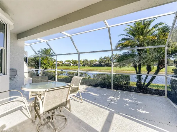 a view of a patio with a table and chairs