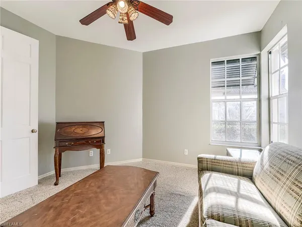 a bedroom with a bed and a chair
