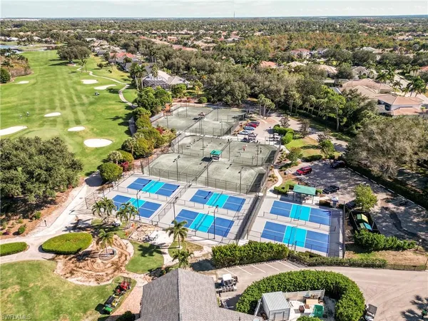 an aerial view of residential houses with outdoor space