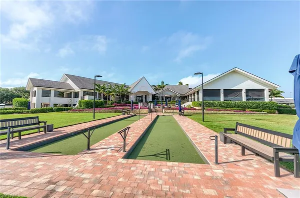 a view of houses with swimming pool and yard