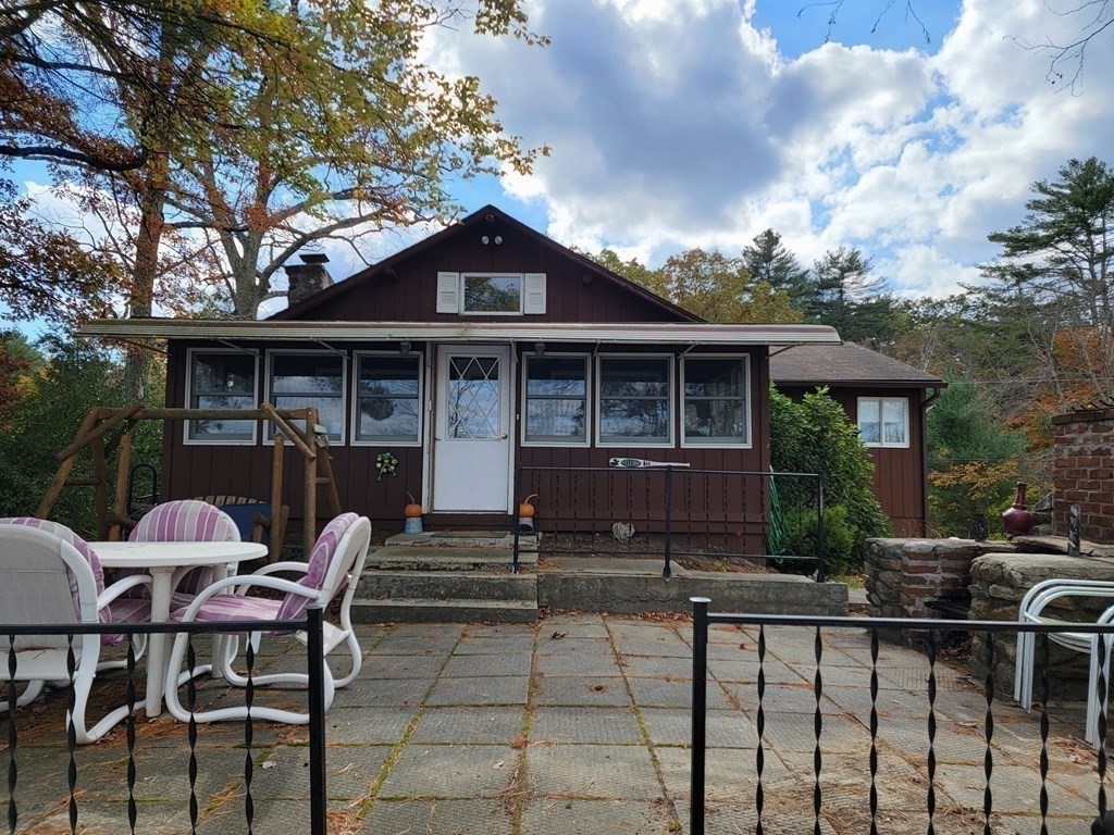 301 Beaver Lake Road Ware, MA 01082 - Photo 13 of 38 a front view of house with yard outdoor seating and barbeque oven